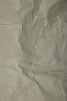 Gray paper crumpled background photo