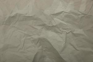 Gray paper crumpled background photo