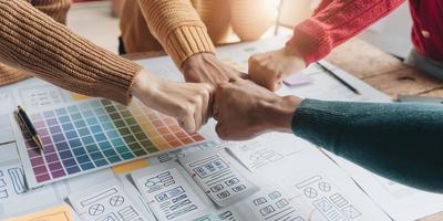 Successful meeting. Teamwork and programming websites and mobile applications on the phone, so-called. user experience UX. Web designer, UX UI designer planning application for mobile phone. photo
