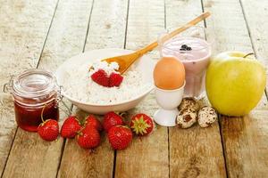 Healthy breakfast. Different food on wooden table. photo