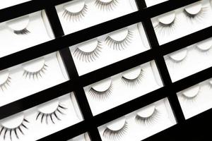 Samples of artificial eyelashes in the cosmetic shop photo