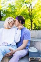 Sensual and loving teenager couple in a skate-park photo