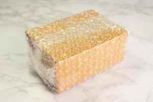 Bubbles covering the box by bubble wrap for protection product photo