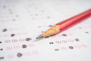 Answer sheets with pencil drawing fill to select choice, education concept. photo