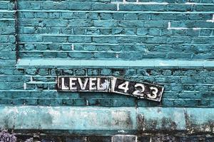 Detailed view at a colorful old and weathered brick wall texture as a panoramic background. photo