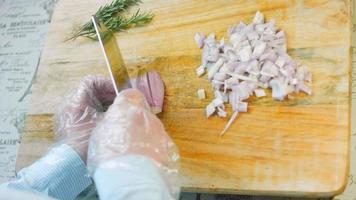 The chef slices the red onion. Macro shooting video