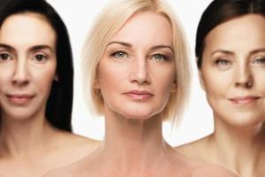 Group of good looking middle aged women with wrinkled skin photo