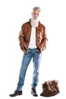 Handsome bearded senior man with leather bag and jacket on white background photo