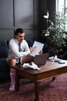 Businessman without pants is working from home photo