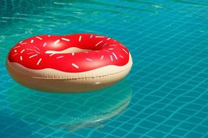 Inflatable swim ring in shape of donut photo