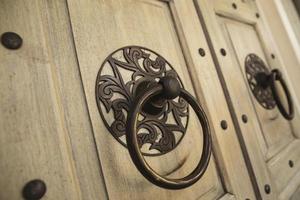 Background of the ancient round door handle photo