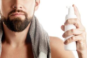 Man with a cleansing or shaving foam photo