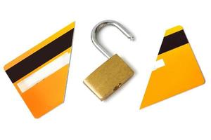 Padlock and broken credit card on white background photo