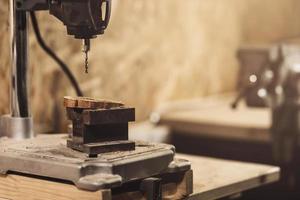 Details of drill machine in the carpentry workshop photo