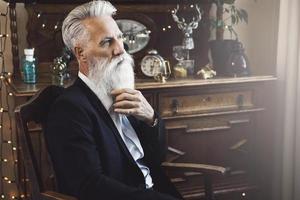 Handsome bearded senior man posing in studio photo