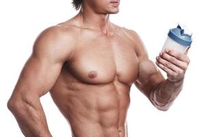 Muscular bodybuilder with a shaker full of whey protein photo