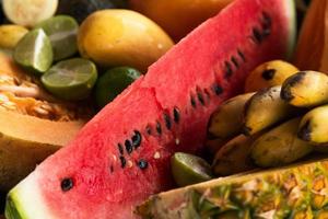 Closeup of different sweet fruits in bowl photo