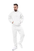 Handsome man wearing blank white hoodie and pants on white background photo