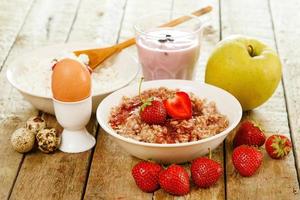 Healthy breakfast. Different food on wooden table. photo