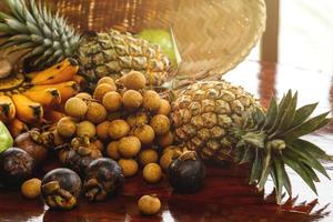 Close up background of different tropical fruits photo