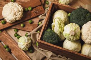 A lot of different cabbages in the wooden box photo