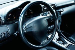 Car's interior. Steering wheel inside modern a car. photo