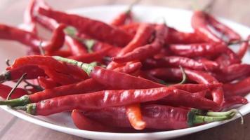 Red cayenne peppers on a plate video