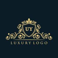 Letter UY logo with Luxury Gold Shield. Elegance logo vector template.