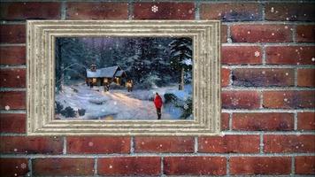 snow falling on Christmas picture frame and brick wall video