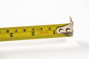 yellow tape measure to measure small spaces photo