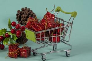 Christmas shopping cart with gifts and Christmas photo