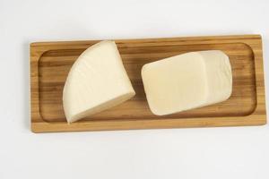 Minas half-cured cheese on a bamboo tray, photo
