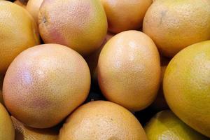 Stack of Grapefruits on a market stall photo