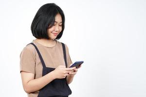 Using Smartphone and Smiling Of Beautiful Asian Woman Isolated On White Background photo