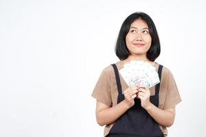 Holding Indonesia New Banknote Of Beautiful Asian Woman Isolated On White Background photo