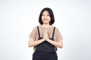 Doing Namaste Greeting Of Beautiful Asian Woman Isolated On White Background photo