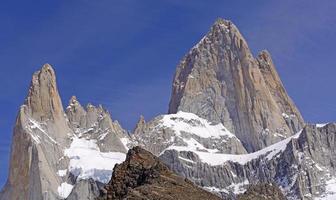 Dramatic Peaks Piercing a Blue Sky photo