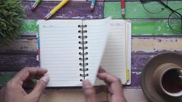 Paging through small notebook planner video
