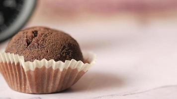close up of chocolate muffin on table video