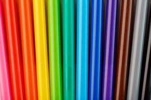 Multi-colored felt-tip pens, markers on a white isolated background photo