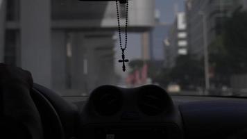 Christian Cross Hangs In Car Interior Driving, Dubai Downtown City video