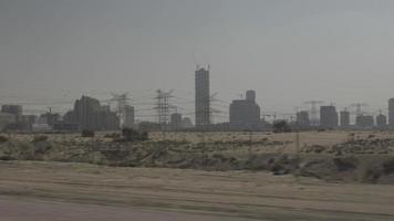 Driving By Distant Building Construction In Dubai video