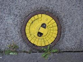 yellow manhole detail photo