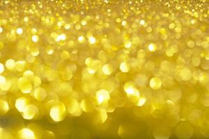 Abstract golden texture in blurry light for background. Glitter pattern for photo effect and wallpaper