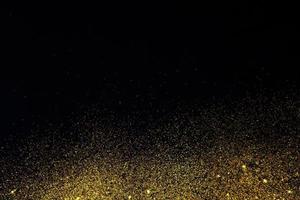 Dark texture with a sprinkling of gold. Backdrop with golden sparkle for overlay photo effect filters. fancy, luxury, themed backgrounds.