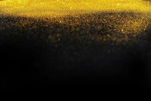 Dark texture with a sprinkling of gold. Backdrop with golden sparkle for overlay photo effect filters. fancy, luxury, themed backgrounds.