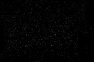 Dark texture with a sprinkling of gold. Backdrop with golden sparkle for overlay photo effect filters. fancy, luxury, themed backgrounds.