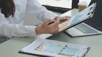 Businessman working with smart phone and laptop and digital tablet computer in office with digital marketing media in virtual icon video