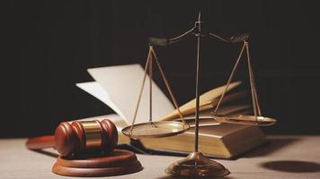 Justice and law concept.Male judge in a courtroom with the gavel, working with, computer and docking keyboard, eyeglasses, on table in morning light video