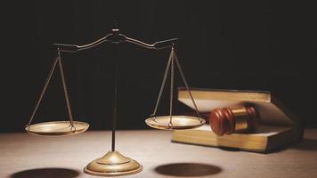 Justice and law concept.Male judge in a courtroom with the gavel, working with, computer and docking keyboard, eyeglasses, on table in morning light video